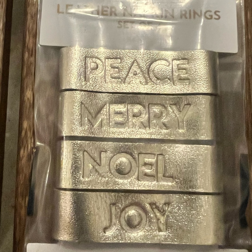Set of 4 leather embossed Christmas napkin rings.